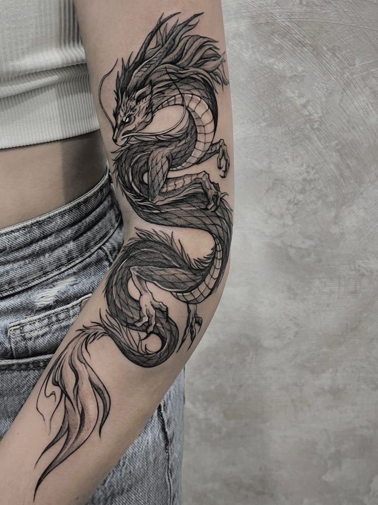dragon tattoo wrapped around arm