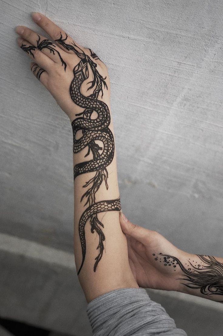 Snake Wrapped Around Arm Tattoo